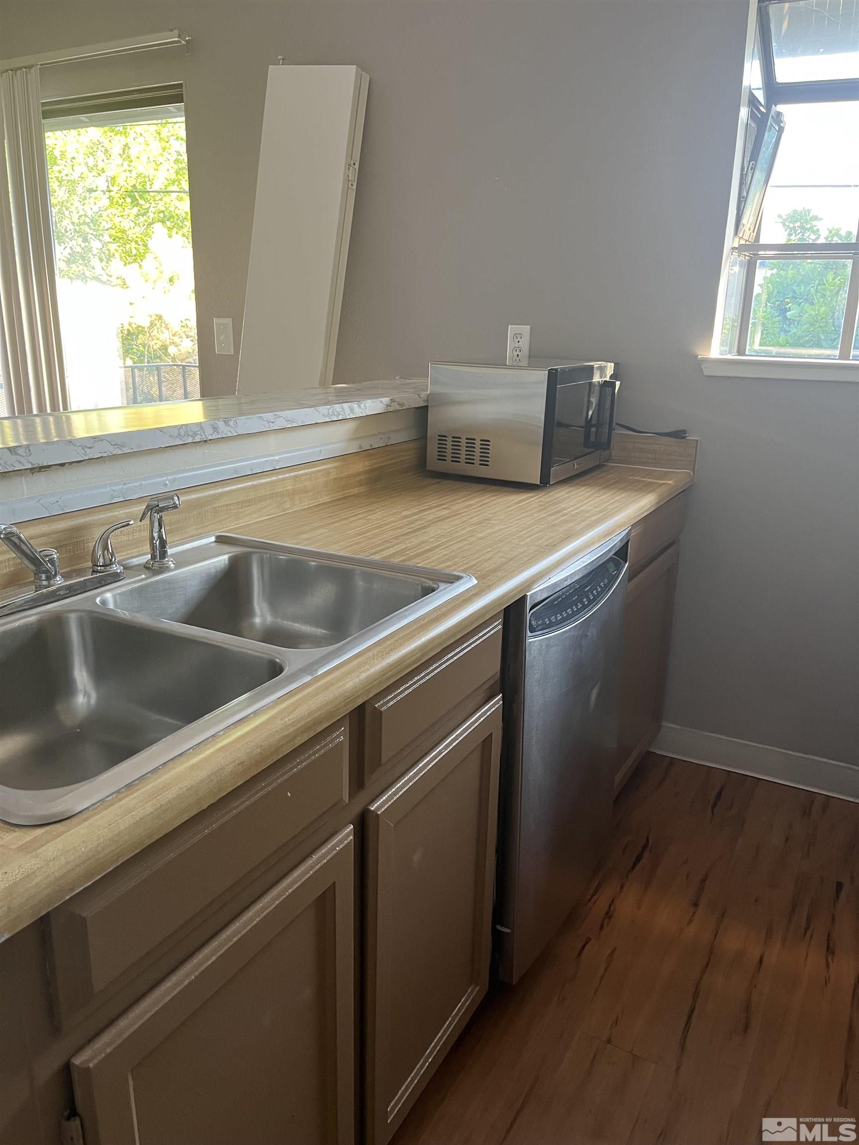 2197 Kietzke Lane, Unit E Reno, NV 89502 - Photo 3 of 7 a view white cabinets and a sink