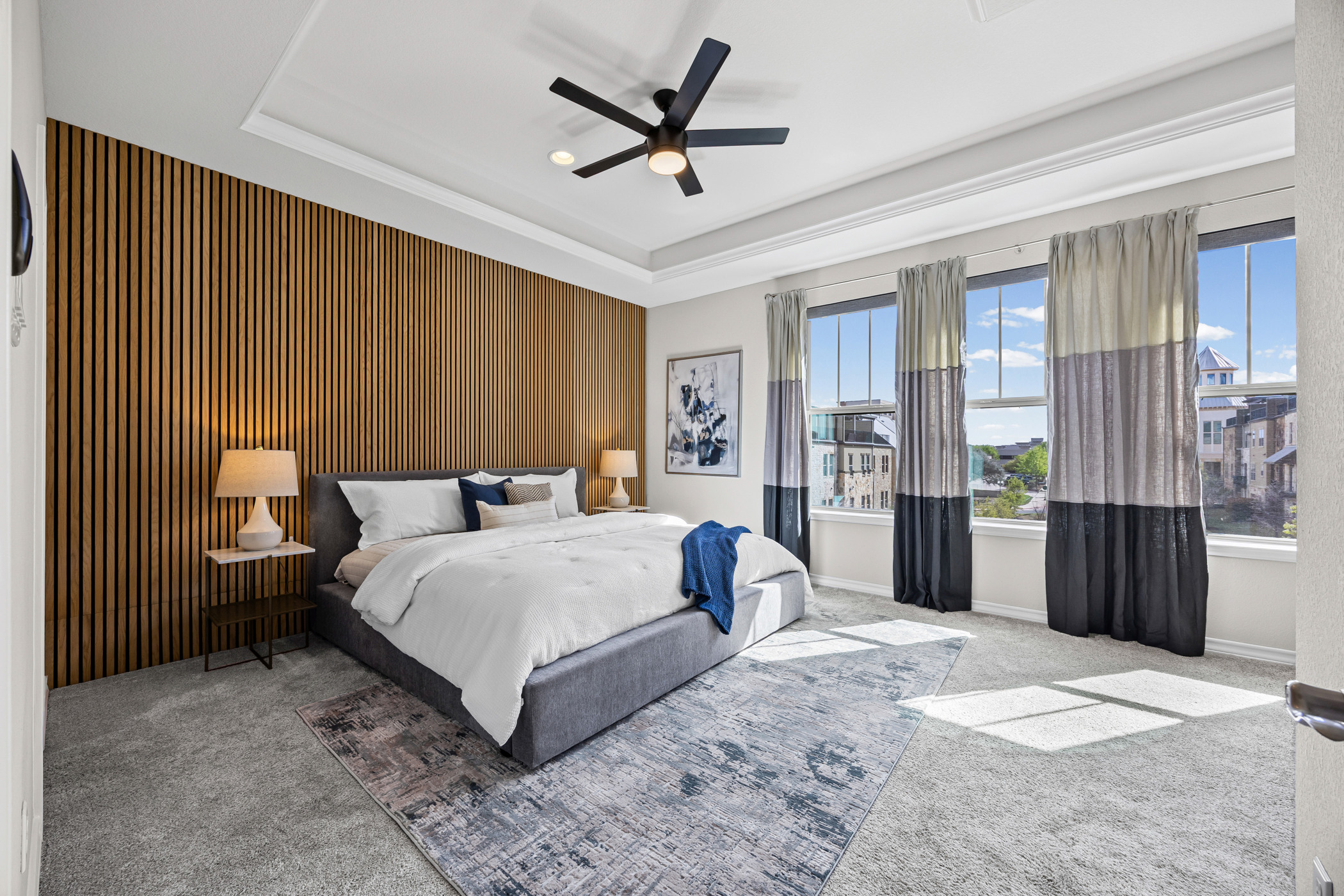 1112 Highknoll Lane Georgetown, TX 78628 - Photo 16 of 40 Generous owner's retreat with large windows and stylish feature wall