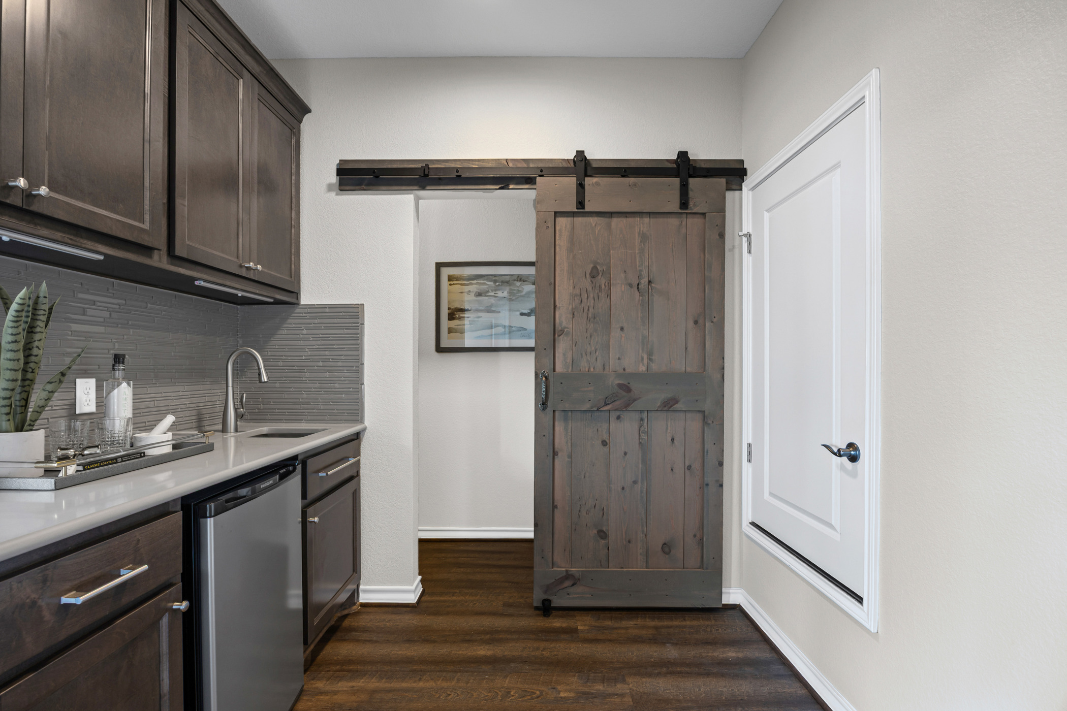 1112 Highknoll Lane Georgetown, TX 78628 - Photo 27 of 40 Fourth floor featuring an upper-level wet bar with sink and beverage refrigerator
