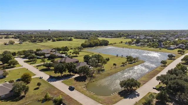 an aerial view of a house with a swimming pool