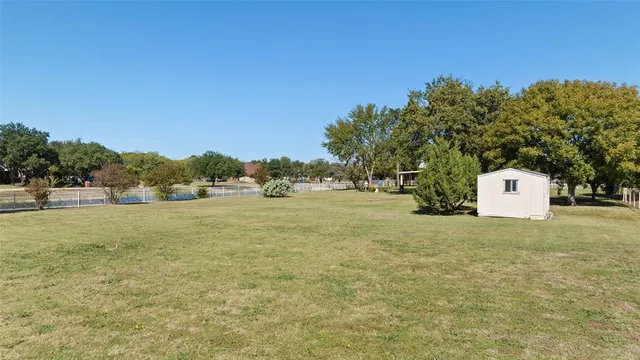 a view of a field with tree s