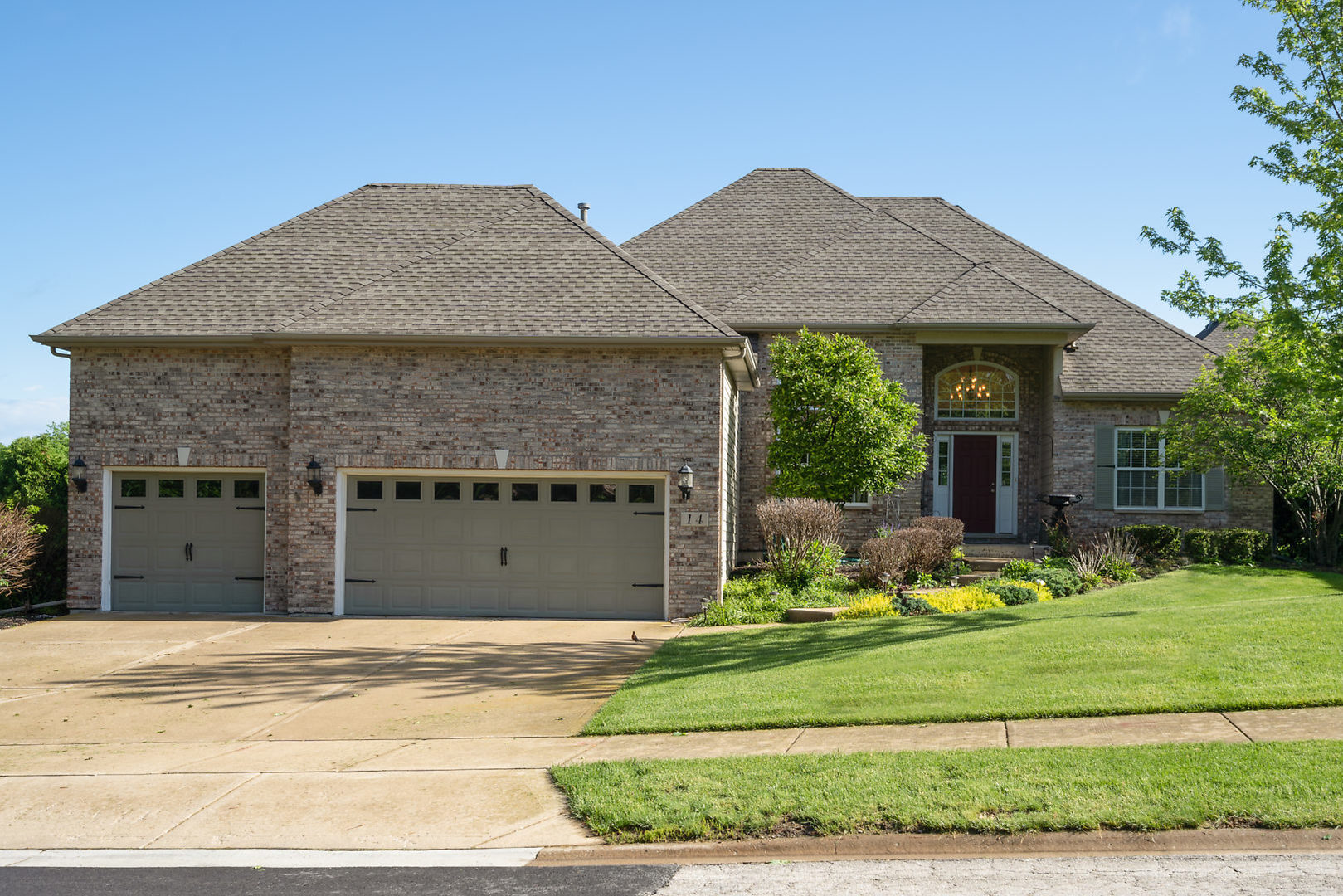 14 Winthrop New Road Sugar Grove, IL 60554 - Photo 1 of 25 a front view of a house with garden