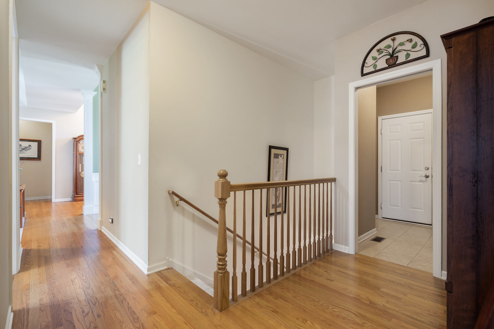 14 Winthrop New Road Sugar Grove, IL 60554 - Photo 16 of 25 a view of a hallway view with wooden floor and staircase