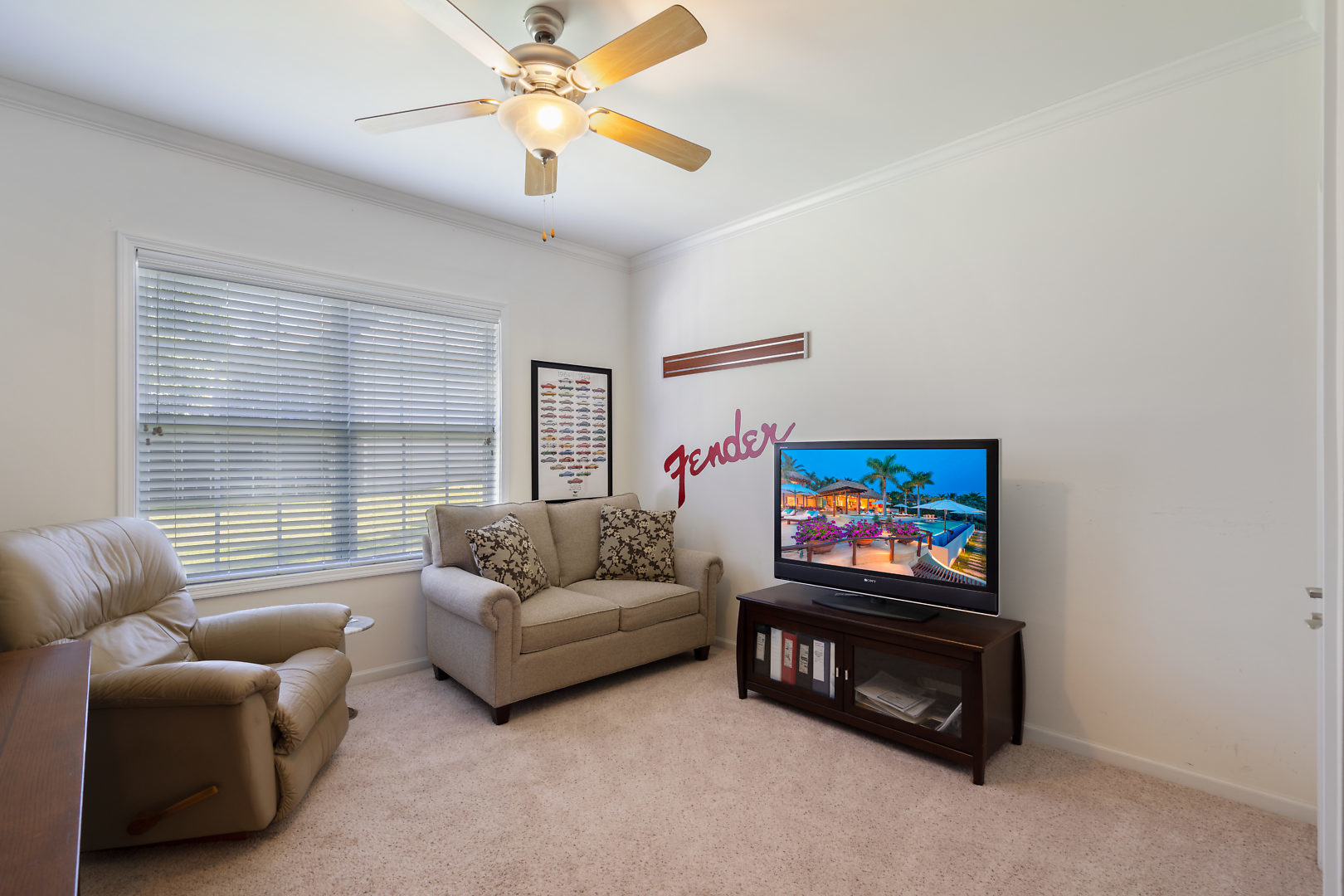 14 Winthrop New Road Sugar Grove, IL 60554 - Photo 19 of 25 a living room with furniture a flat screen tv and a wall painting