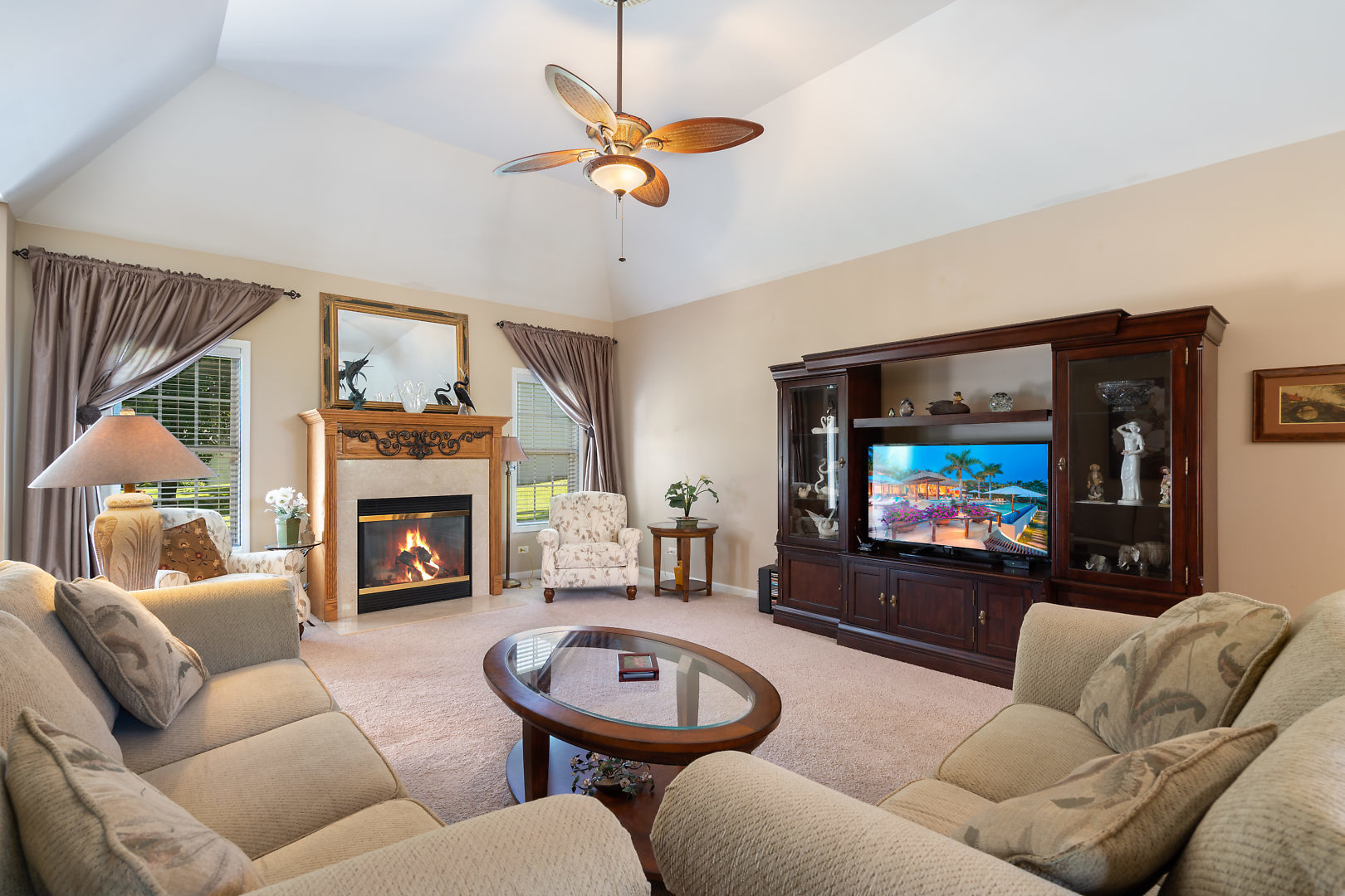 14 Winthrop New Road Sugar Grove, IL 60554 - Photo 6 of 25 a living room with furniture a flat screen tv and a fireplace