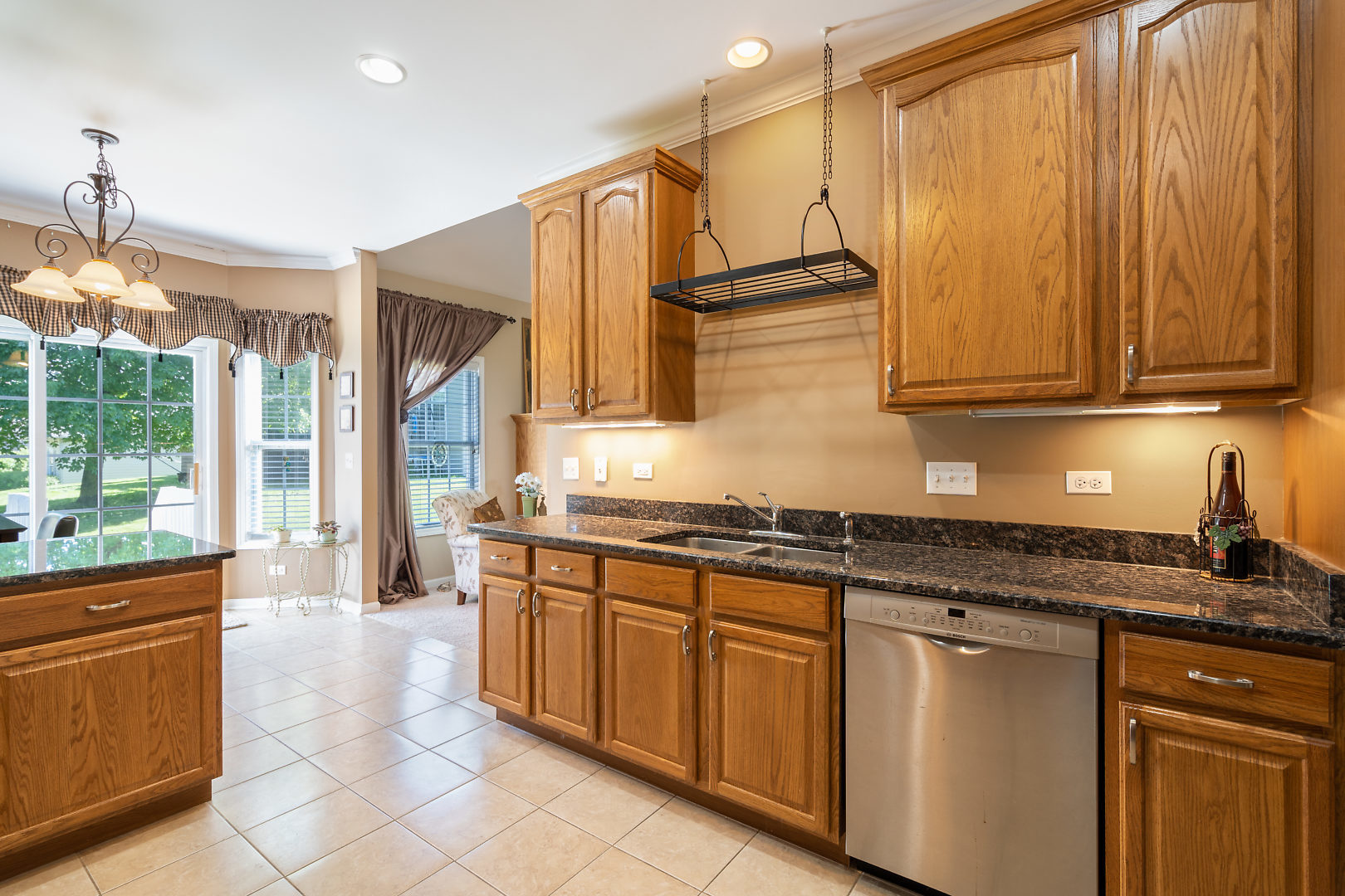 14 Winthrop New Road Sugar Grove, IL 60554 - Photo 10 of 25 a kitchen with stainless steel appliances granite countertop a stove a sink and a microwave