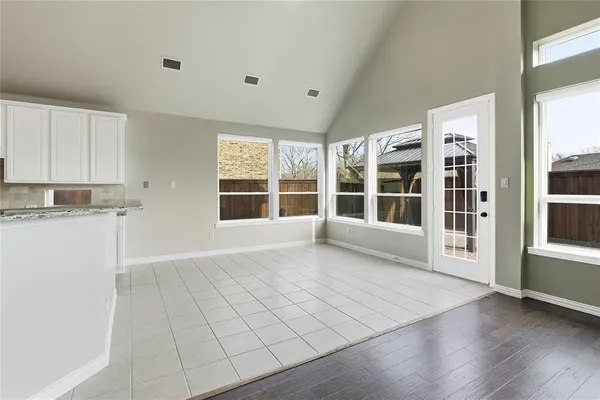 a view of a livingroom with wooden floor a fireplace and window