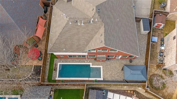an aerial view of residential houses with outdoor space