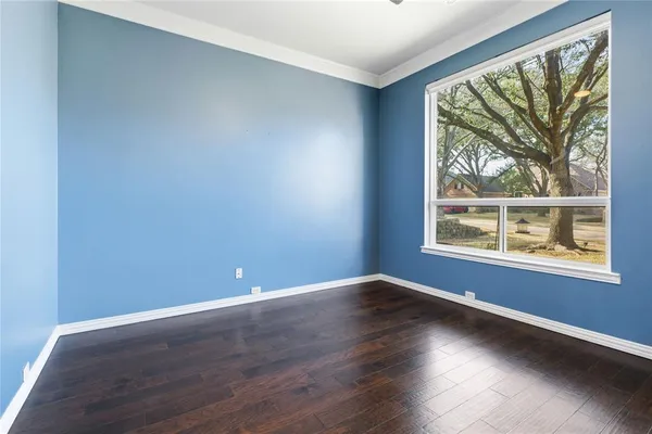 a view of an entryway with wooden floor