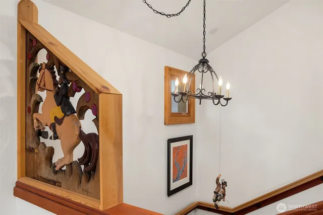 a view of a room with a door and wooden floor