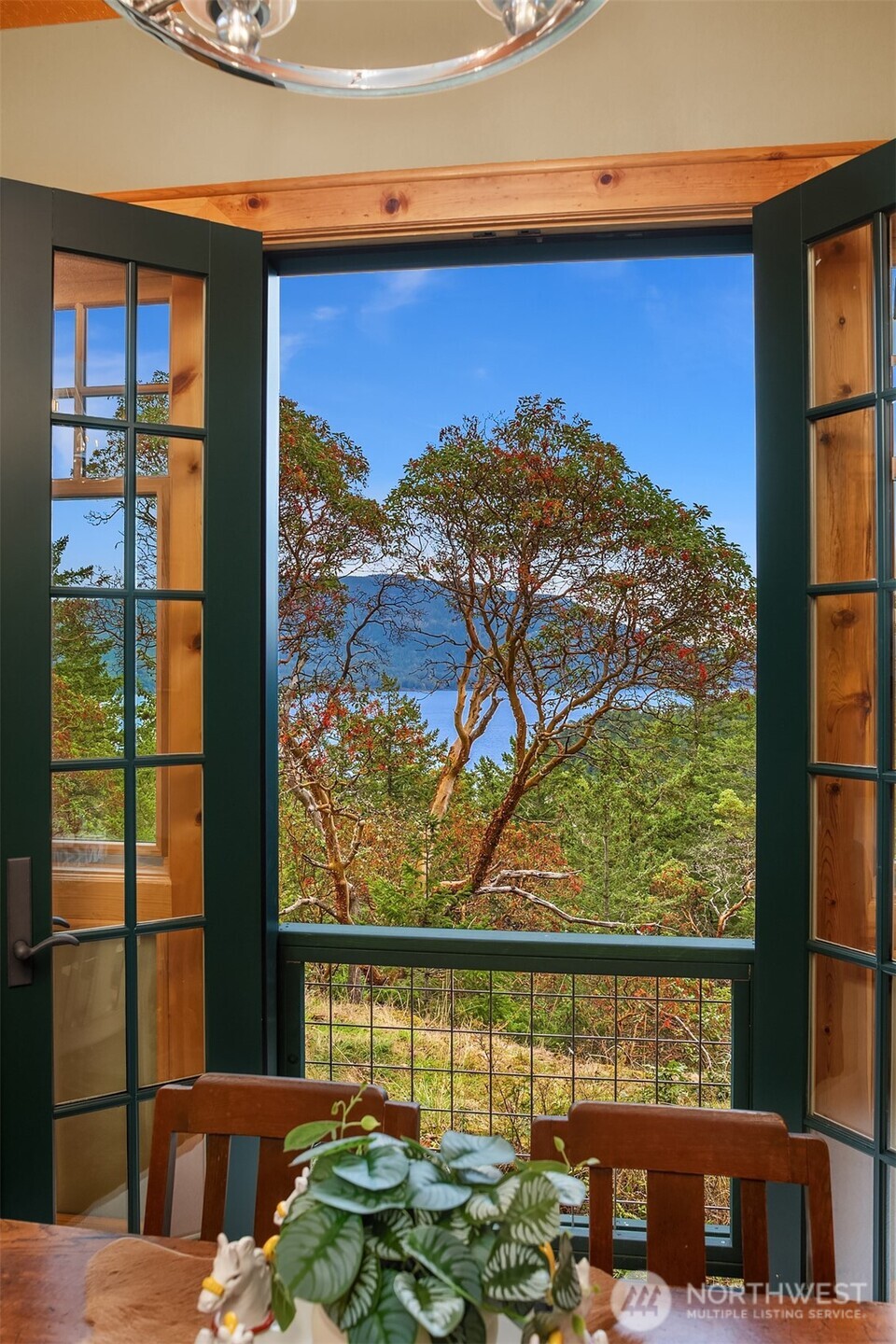 223 Blanc Road Orcas Island, WA 98245 - Photo 13 of 40 a view of balcony with a table and chairs