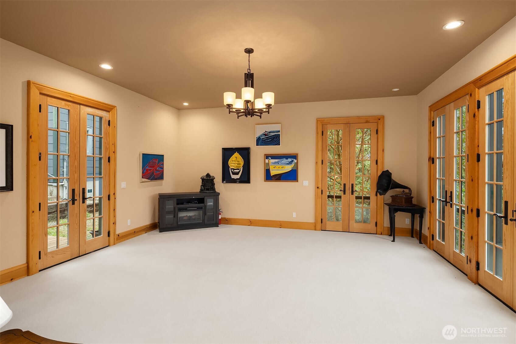 223 Blanc Road Orcas Island, WA 98245 - Photo 14 of 40 a living room with furniture and a chandelier