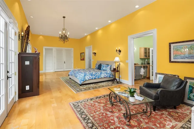 a living room with a couch and a chandelier