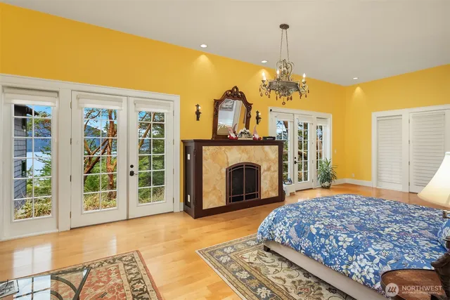 a bedroom with a bed and a fireplace