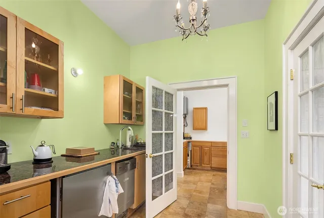 a bathroom with a sink a mirror and a shower