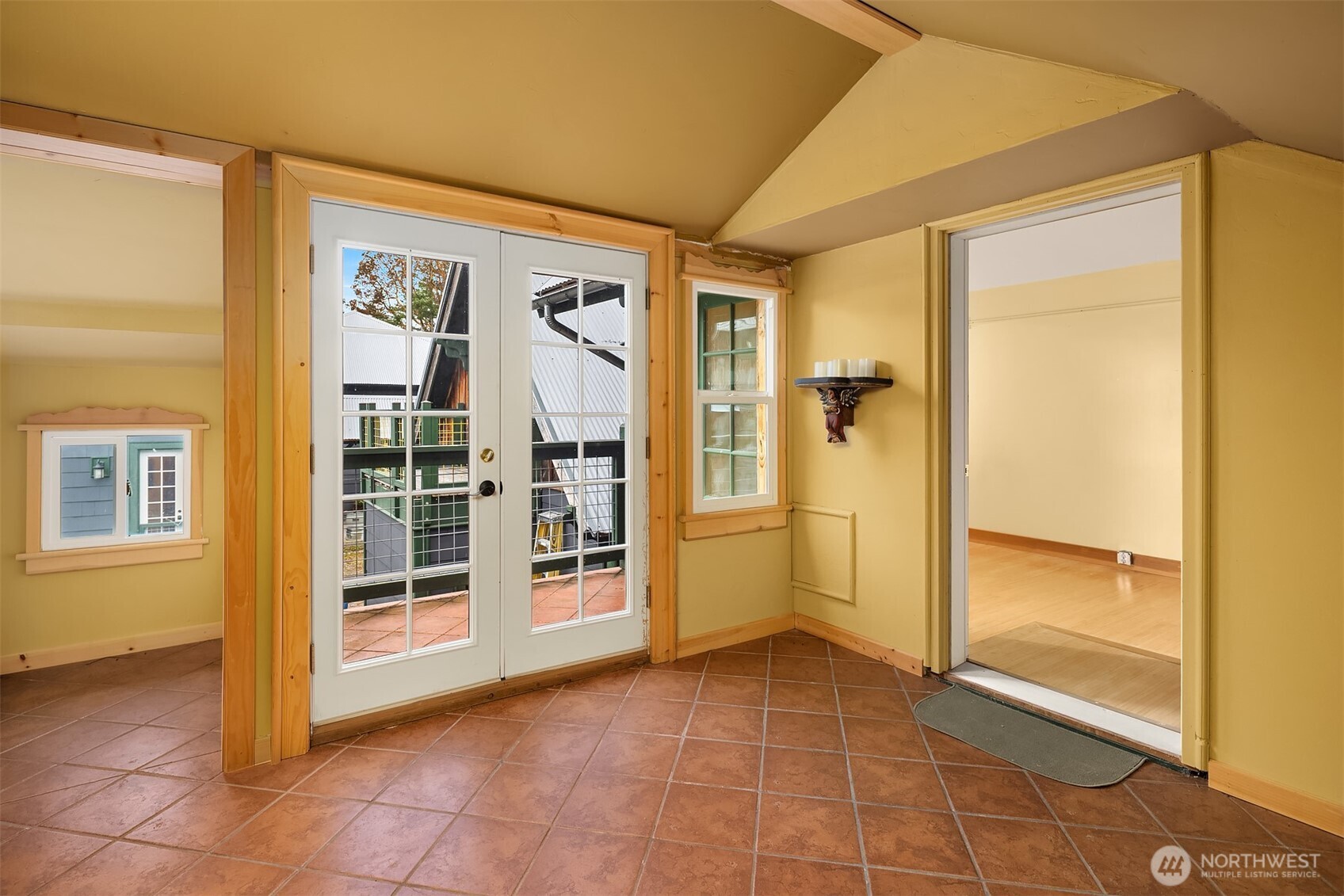 223 Blanc Road Orcas Island, WA 98245 - Photo 26 of 40 a view of a big room with wooden floor and windows