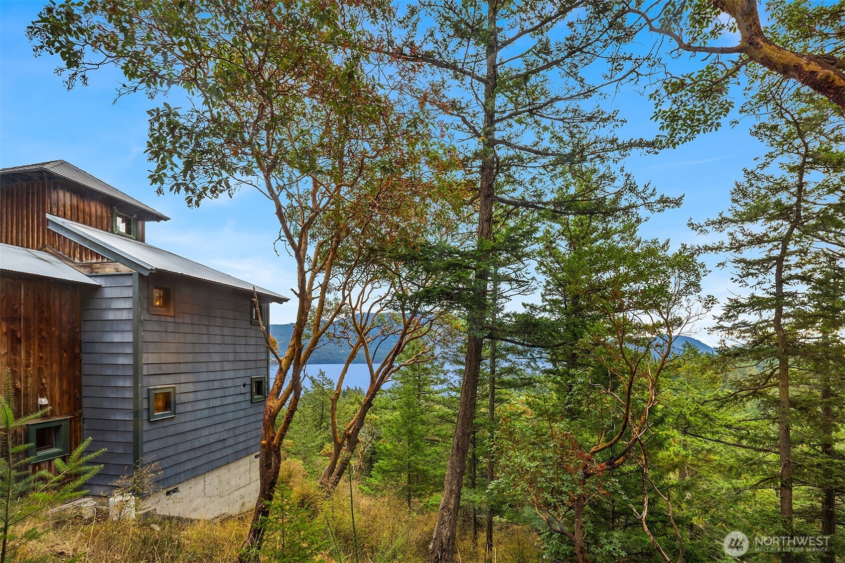 223 Blanc Road Orcas Island, WA 98245 - Photo 34 of 40 a view of a house with a tree