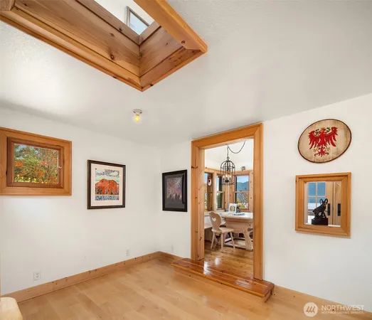 a view of a hallway with paintings on the wall