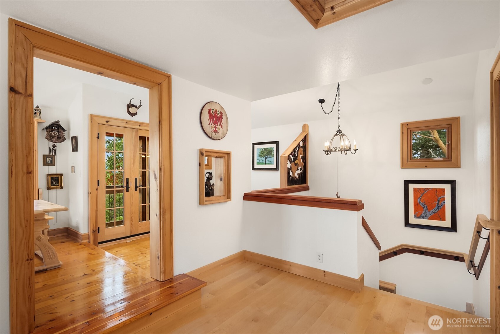 223 Blanc Road Orcas Island, WA 98245 - Photo 10 of 40 a view of a hallway with wooden floor and a living room