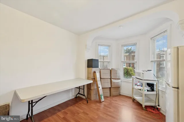 a workspace with furniture wall and a window