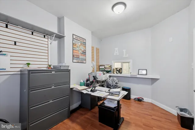 a room with a window and furniture