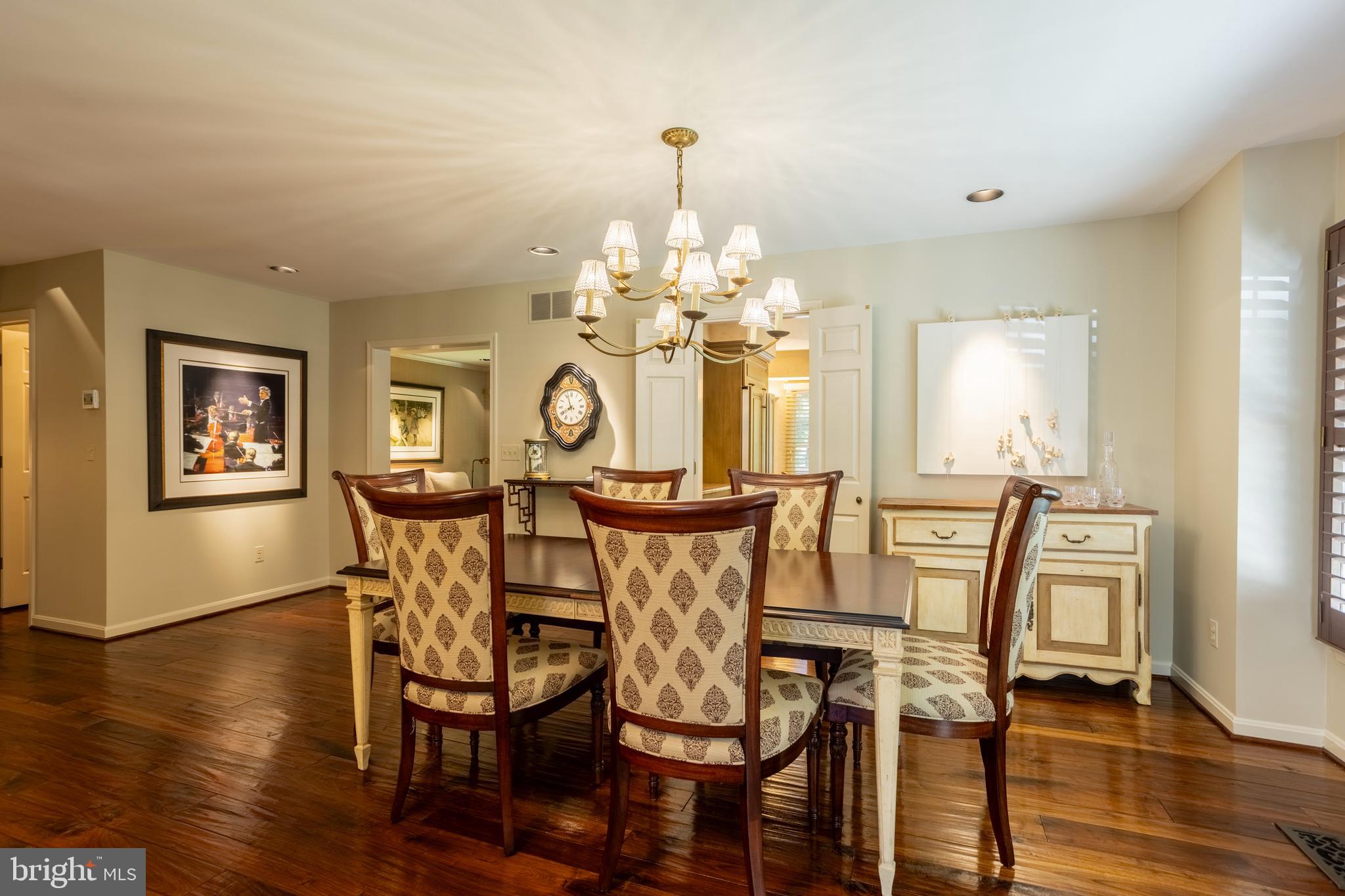 63 Raisin Tree Circle Baltimore, MD 21208 - Photo 12 of 57 a view of a dining room with furniture and wooden floor