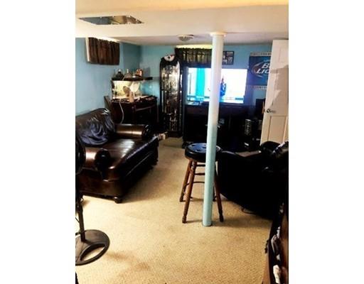 80 Herrman Street West Springfield, MA 01089 - Photo 15 of 19 a living room with furniture and a flat screen tv