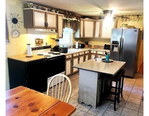 80 Herrman Street West Springfield, MA 01089 - Photo 3 of 19 a kitchen with stainless steel appliances kitchen island granite countertop a sink a stove and refrigerator