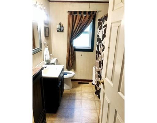 80 Herrman Street West Springfield, MA 01089 - Photo 10 of 19 a bathroom with a sink a mirror and a toilet