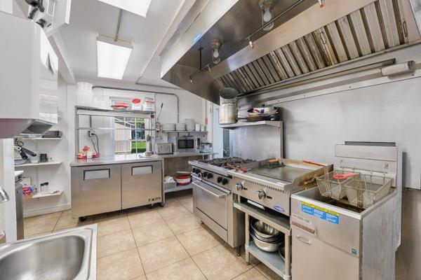 300 Main Street Volant, PA 16156 - Photo 13 of 31 a kitchen with a stove and cabinets