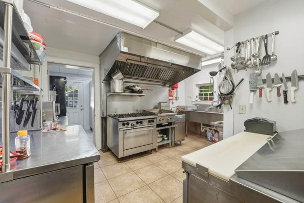 300 Main Street Volant, PA 16156 - Photo 16 of 31 a kitchen with stainless steel appliances granite countertop a sink dishwasher stove and refrigerator