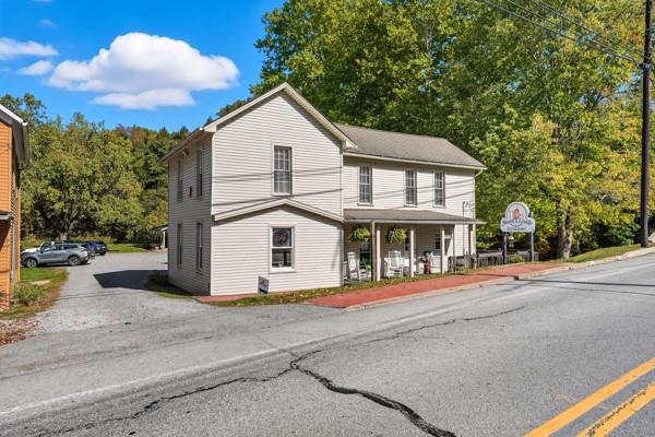 300 Main Street Volant, PA 16156 - Photo 3 of 31 a front view of a house with a yard