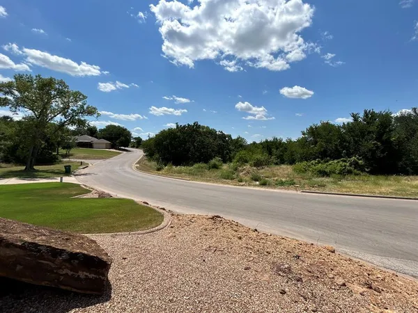 a view of a yard with swimming pool