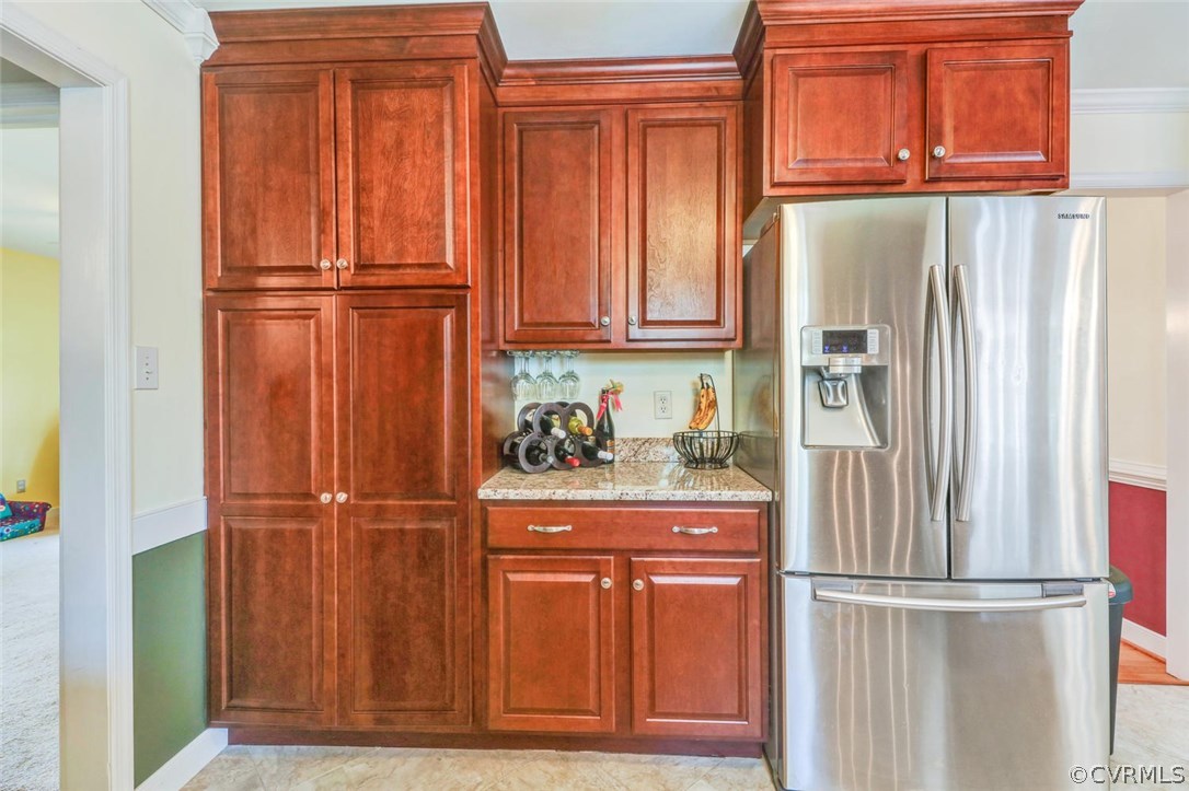 13400 Lady Ashley Road Midlothian, VA 23114 - Photo 10 of 31 a kitchen with stainless steel appliances granite countertop wood cabinets and a refrigerator