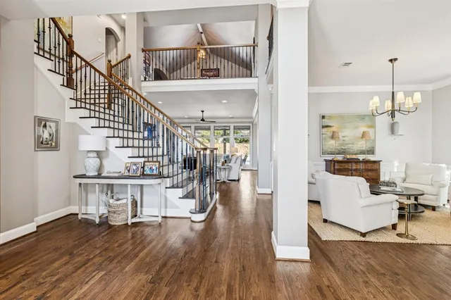 a view of entryway and hall with wooden floor