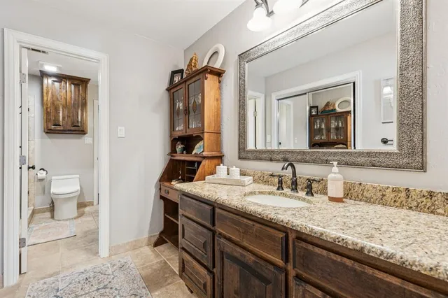 a bathroom with a sink a mirror and a shower