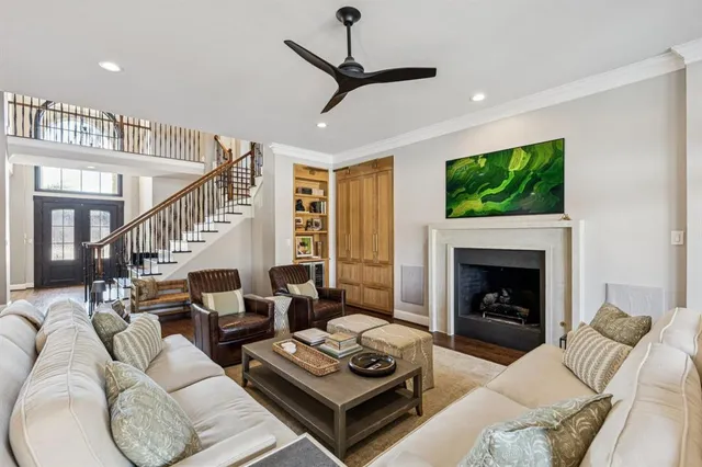 a living room with furniture fireplace and a flat screen tv