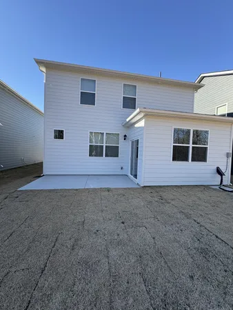 a view of a house with backyard
