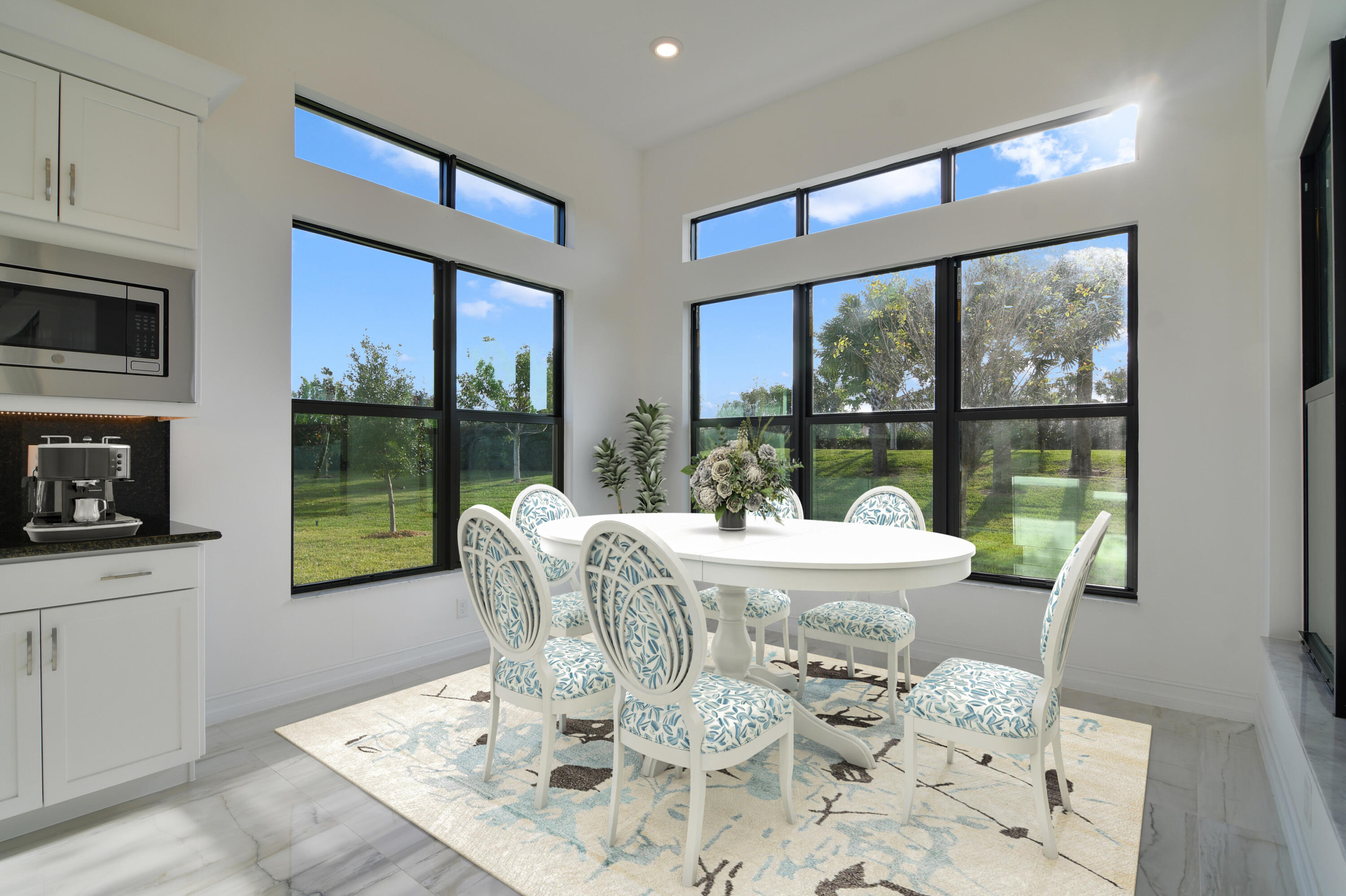 8827 Leon Circle, Unit 286 Parkland, FL 33076 - Photo 4 of 34 a dining room with furniture a flat screen tv and a floor to ceiling window