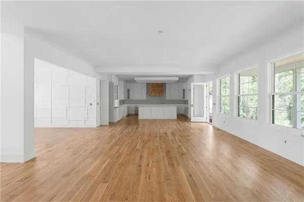 a view of kitchen with cabinets and wooden floor