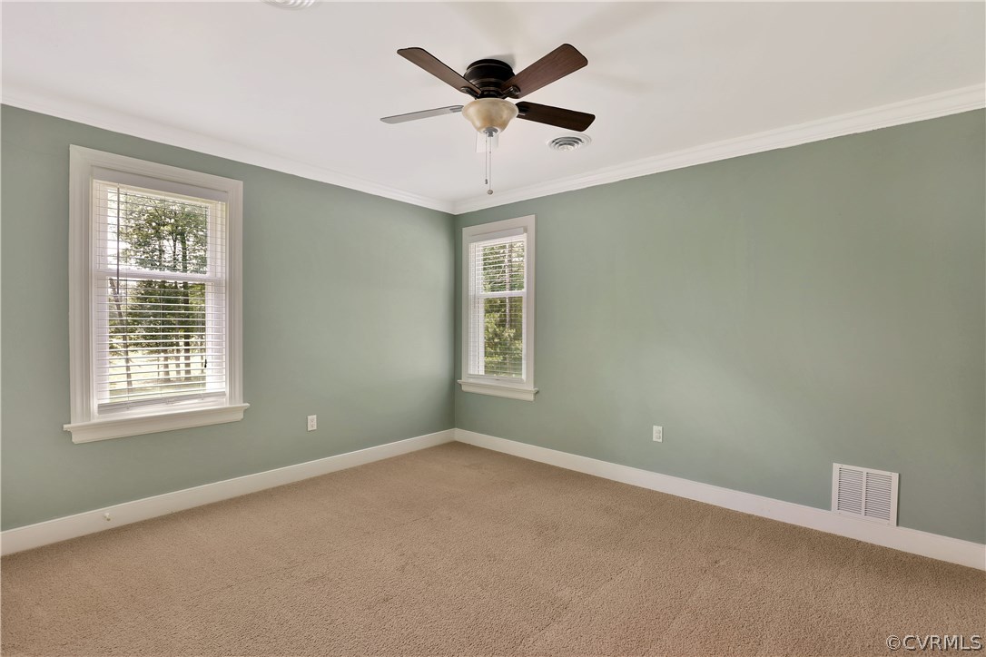 2620 Radstock Road Midlothian, VA 23113 - Photo 17 of 25 an empty room with ceiling fan and window