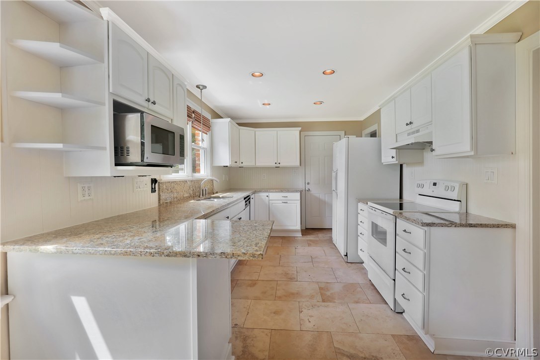 2620 Radstock Road Midlothian, VA 23113 - Photo 7 of 25 a kitchen with stainless steel appliances granite countertop a sink stove refrigerator and white cabinets with wooden floor