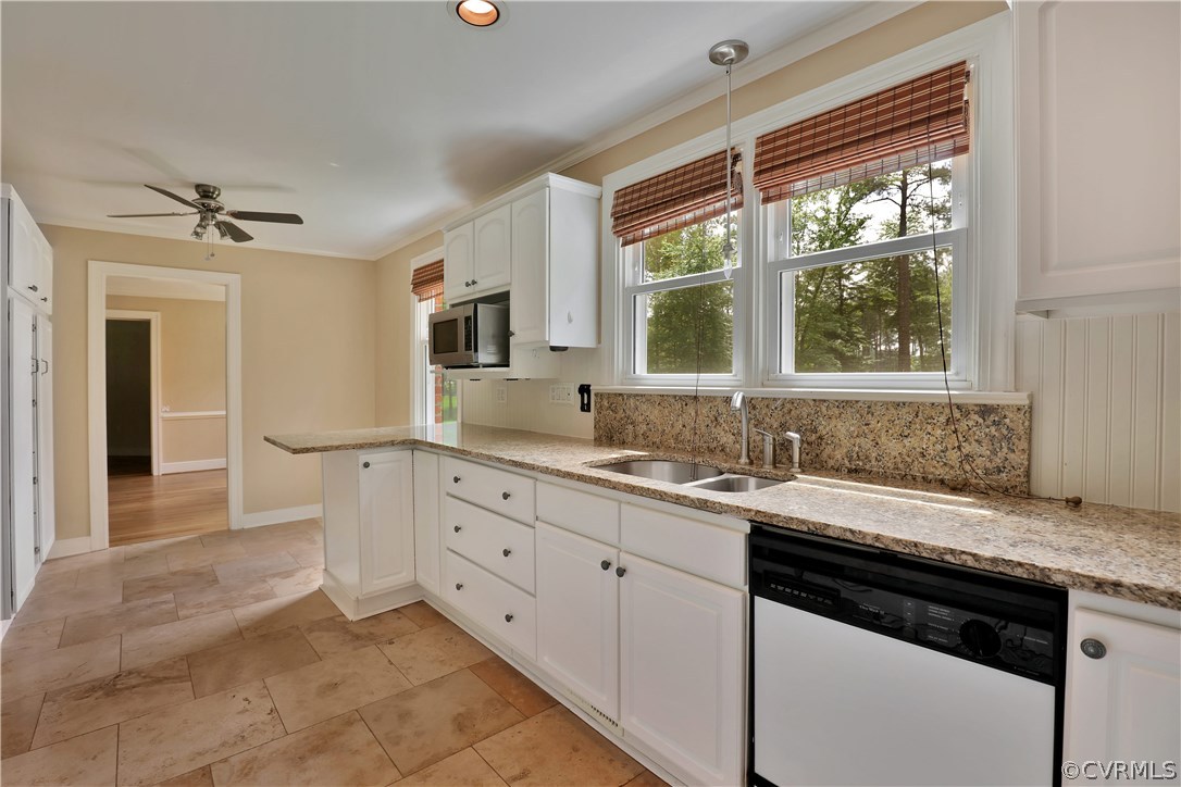 2620 Radstock Road Midlothian, VA 23113 - Photo 9 of 25 a kitchen with granite countertop a sink stainless steel appliances and cabinets