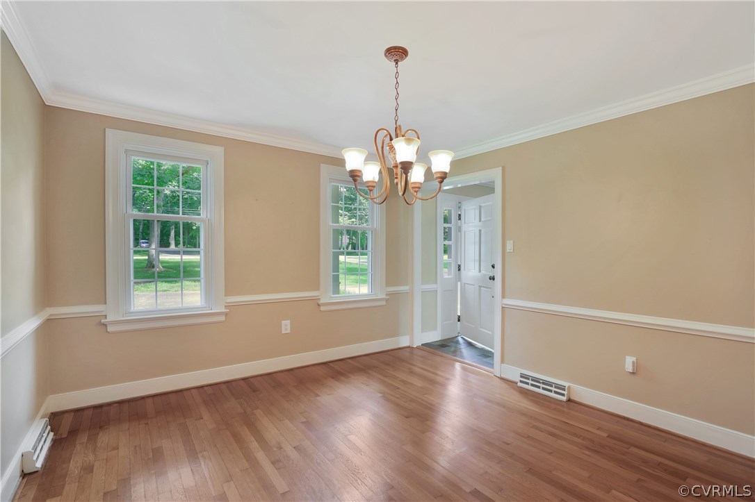 2620 Radstock Road Midlothian, VA 23113 - Photo 10 of 25 an empty room with wooden floor and windows