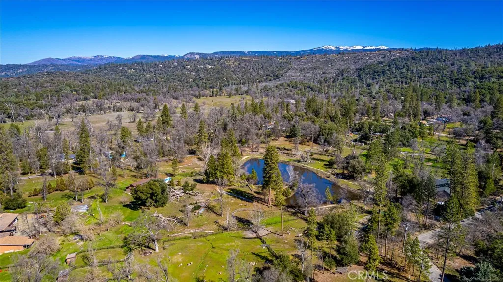 0 Wortham Road Oakhurst, CA 93644 - Photo 18 of 19 a view of a city with mountains in the background