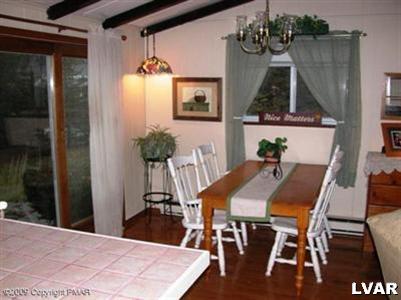 3633 T R 626 Cresco, PA 18326 - Photo 4 of 5 a view of a dining room with furniture and wooden floor