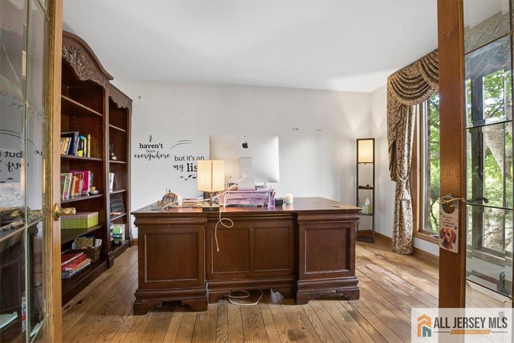 167 Federal Road Monroe Township, NJ 08831 - Photo 7 of 46 a view of a workspace with furniture and a window