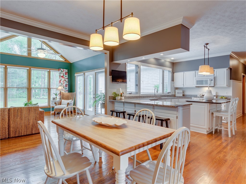 876 Hunter Ridge Circle Fairlawn, OH 44333 - Photo 7 of 35 Eating area with wonderful lighting opens to the gorgeous sun room