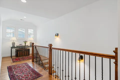 a view of a dining room with furniture wooden floor and chandelier