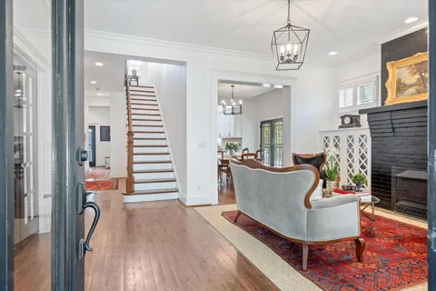 a en suite bathroom with a sink double vanity and a mirror
